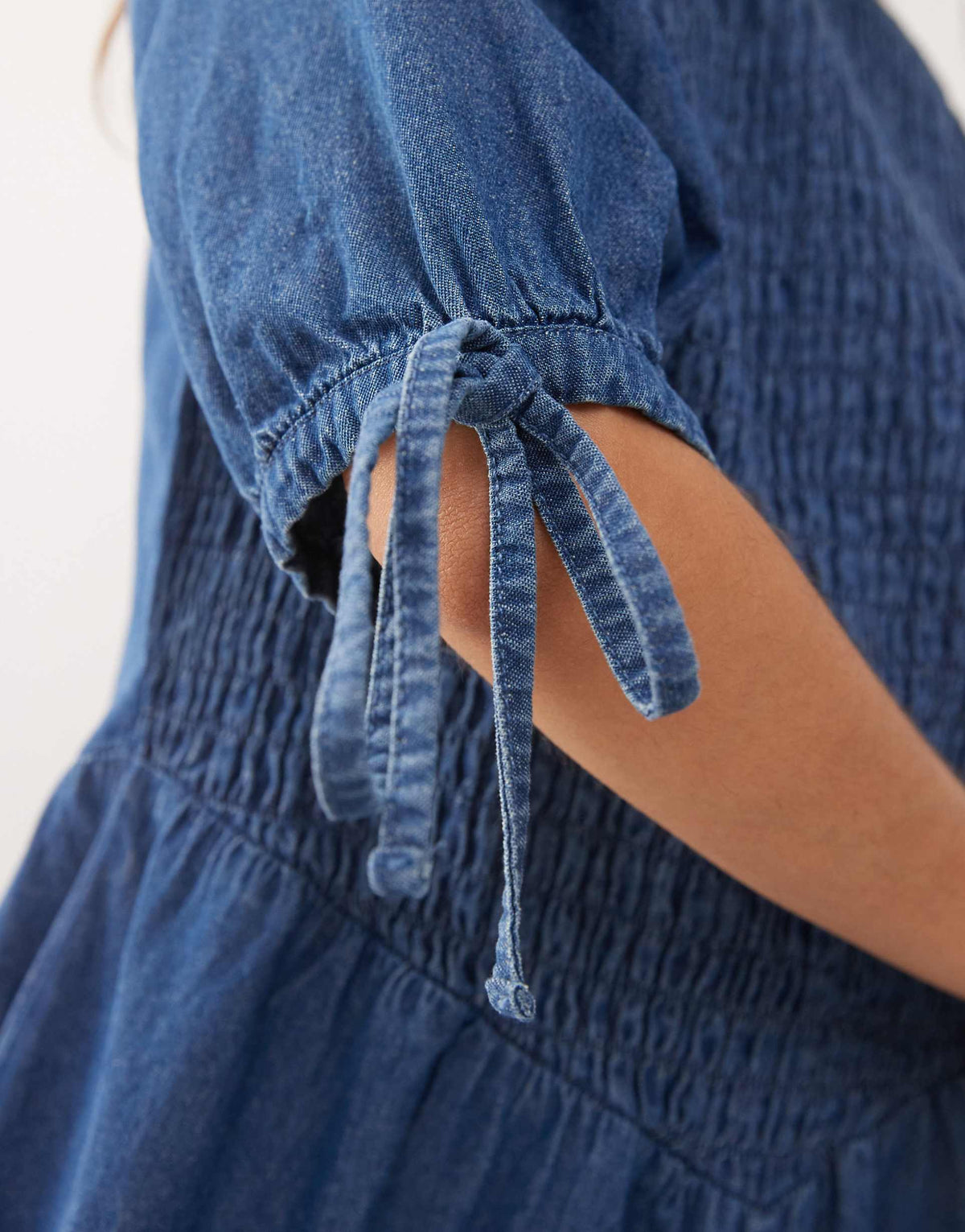 Reclaimed Vintage shirred bodice drop waist mini denim dress in mid blue