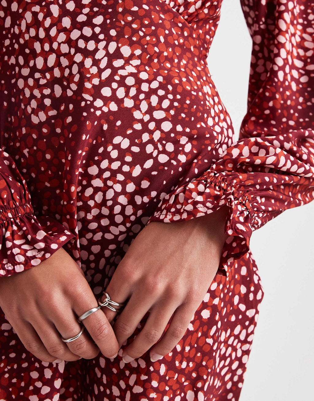 Wednesday's Girl dotty print v-neck mini dress in burgundy and pink