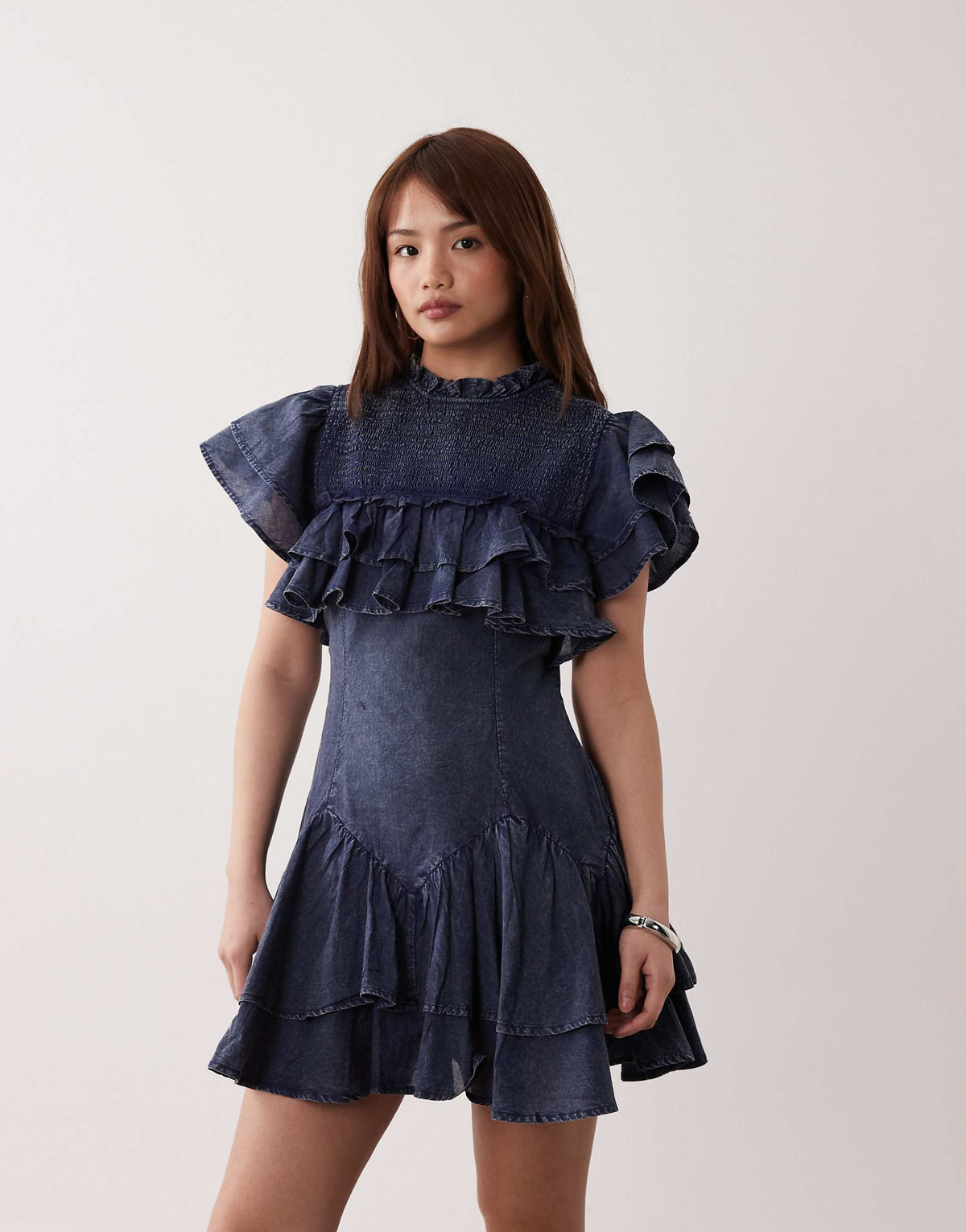 ASOS DESIGN Petite high neck ruffle mini dress with shirring in navy wash