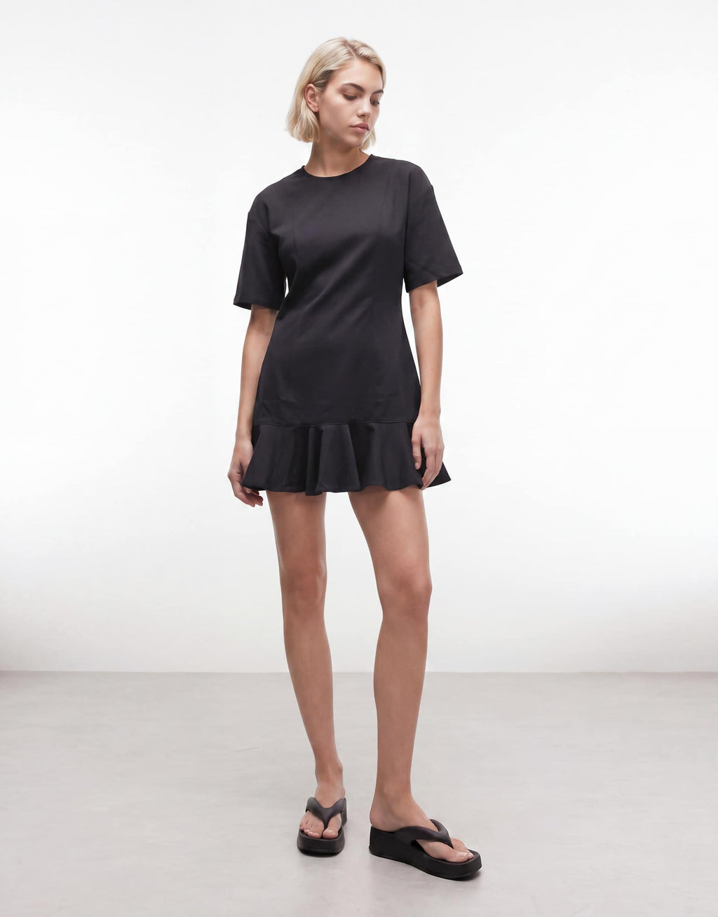 Monki mini dress with ruffle hem detail in black