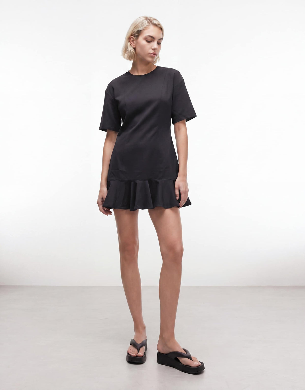 Monki mini dress with ruffle hem detail in black