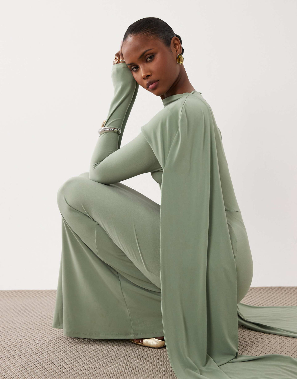 ASOS DESIGN slinky long sleeve maxi dress with extreme cape shoulder detail in sage green