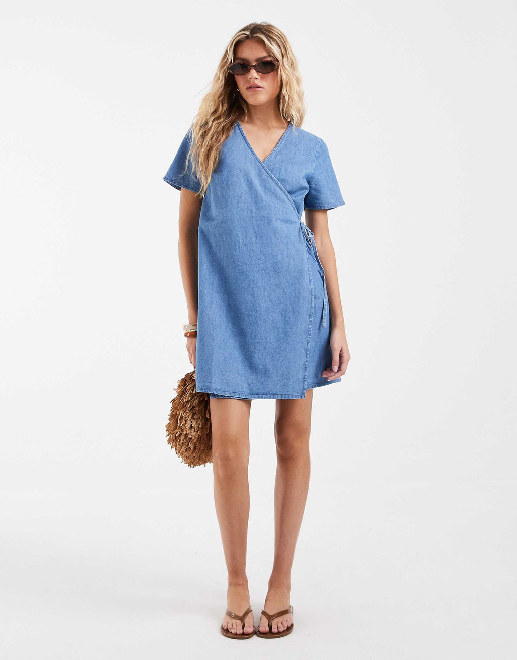 Vero Moda short sleeve wrap front denim mini dress in light blue wash