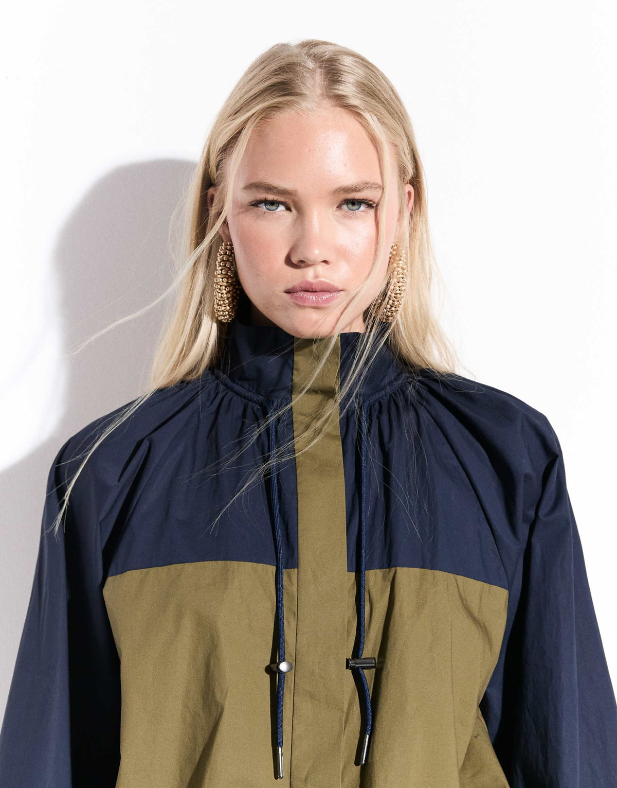 ASOS DESIGN ruffle neck mini track dress in navy and olive color block