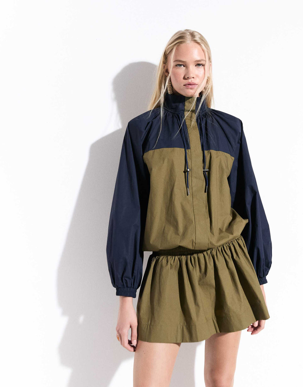 ASOS DESIGN ruffle neck mini track dress in navy and olive color block