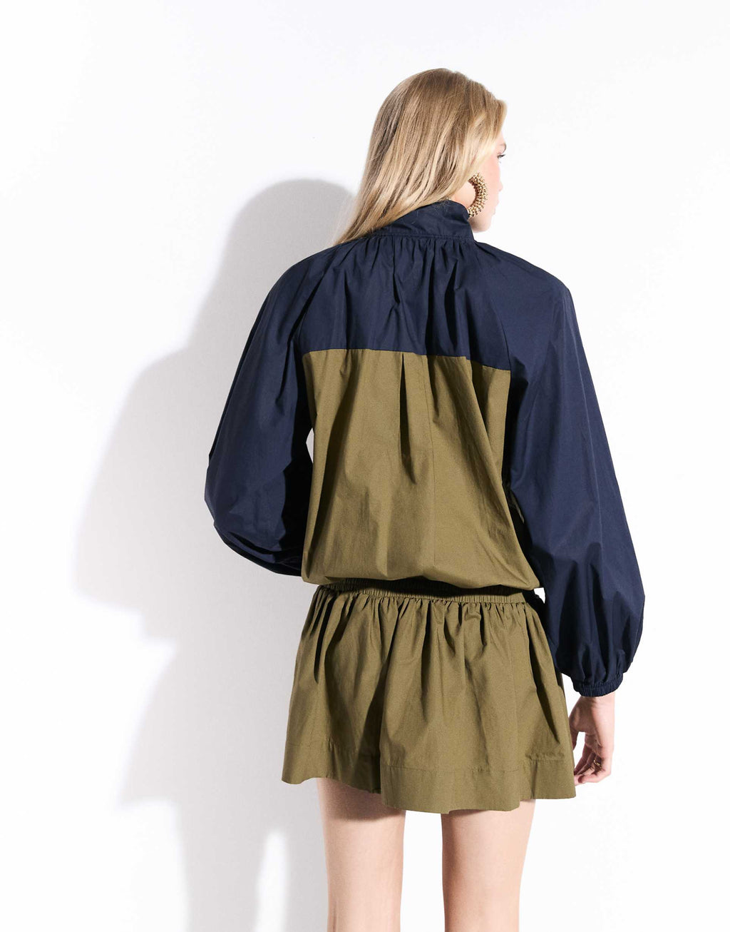 ASOS DESIGN ruffle neck mini track dress in navy and olive color block