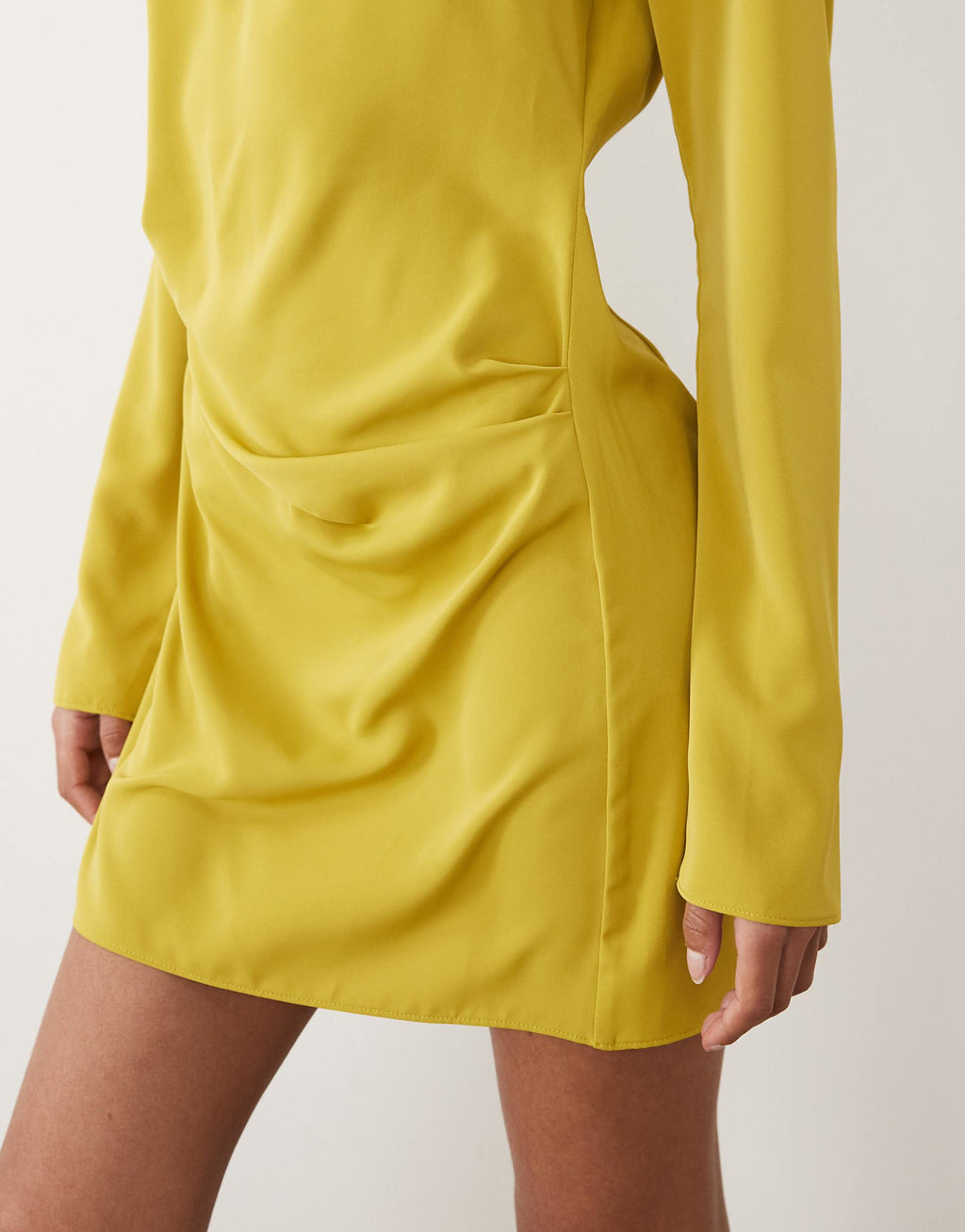 ASOS DESIGN fluid long sleeve mini dress with ruched side detail in gold
