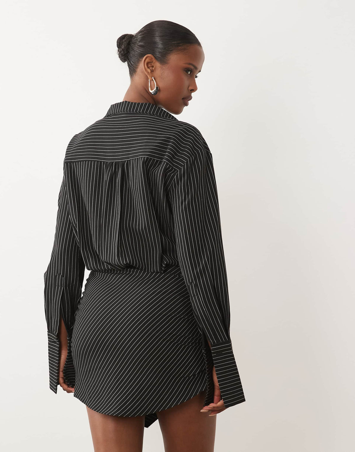 Noughts & Kisses cotton rich button up asymmetric hem deep cuff mini shirt dress in black pinstripe